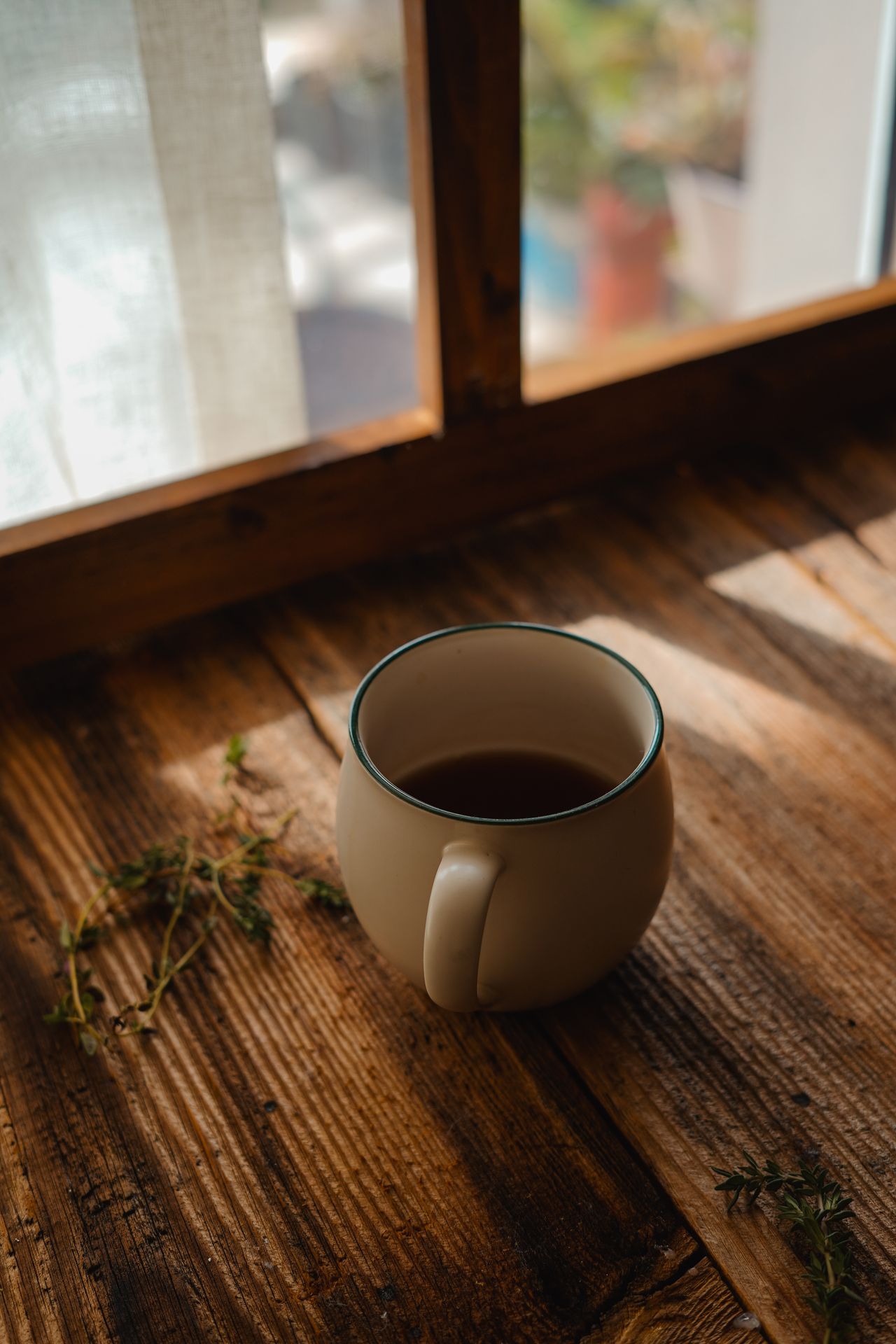 Soft morning light through a window beside a warm mug, a quiet moment of calm before a medical appointment